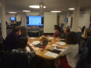 Participants around a table at the usability observation event