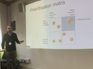 Me introducing the prioritisation matrix during a showcase session