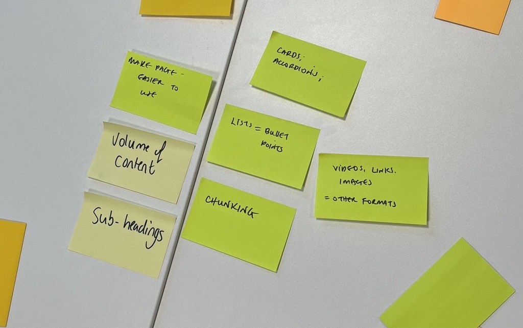 Numerous sticky notes on a table with descriptions of issues relating to long pages. For example volume of content, chunking content, using cards or accordions, using links, videos and images.