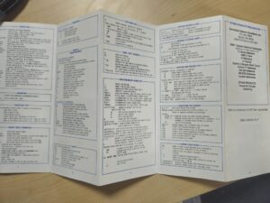 A white folded leaflet with black text