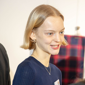 Tartan designer and ECA student, Minty Warner in front of the tartan