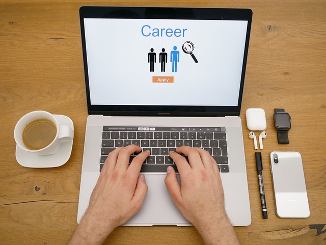 An opened laptop displaying text saying Career.